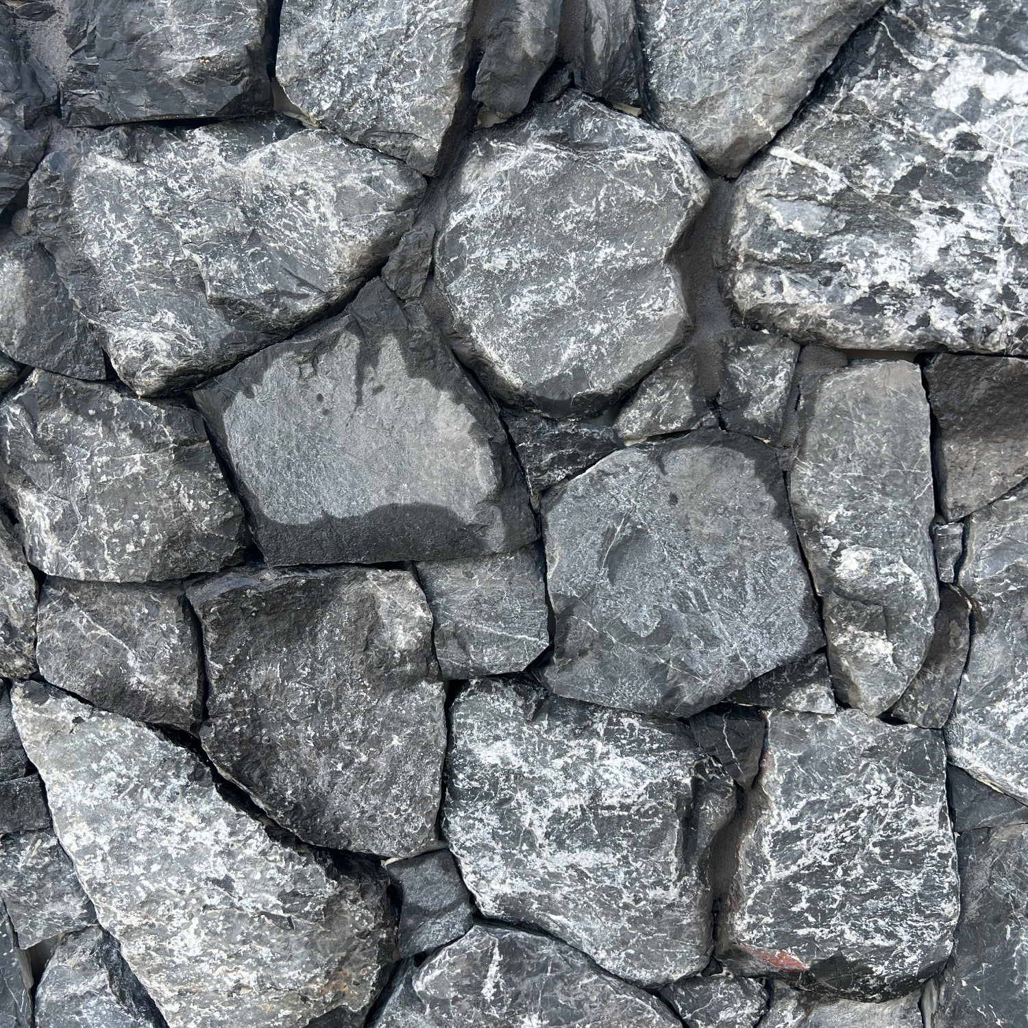 dark slate random freeform natural Stone Cladding for building, home decoration, renovations, interior & exterior walls, garden features and feature walls.