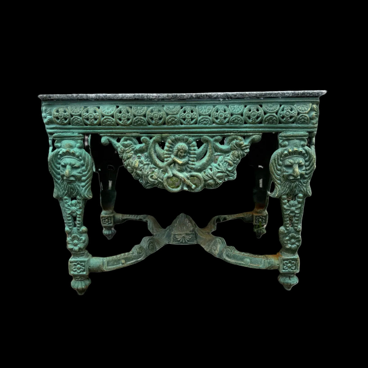 Decorative rustic green desk with intricate designs and a stone table top