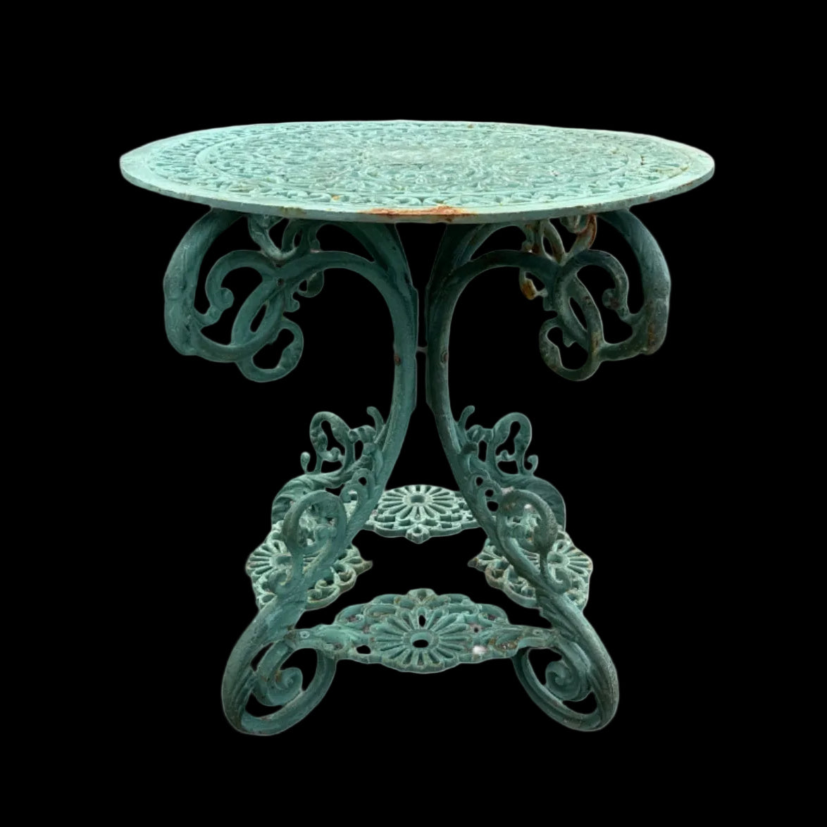 Decorative round cast iron table with intricate metal legs