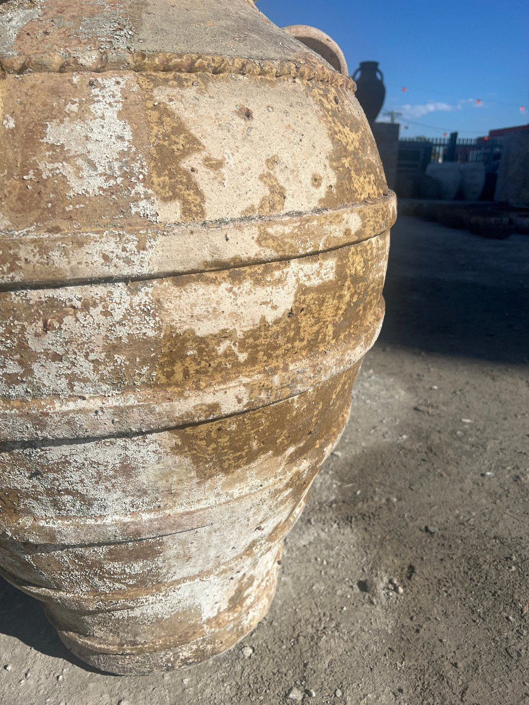 Ancient Ribbed Belly Urn with Handles and warn patina and close up of patina
