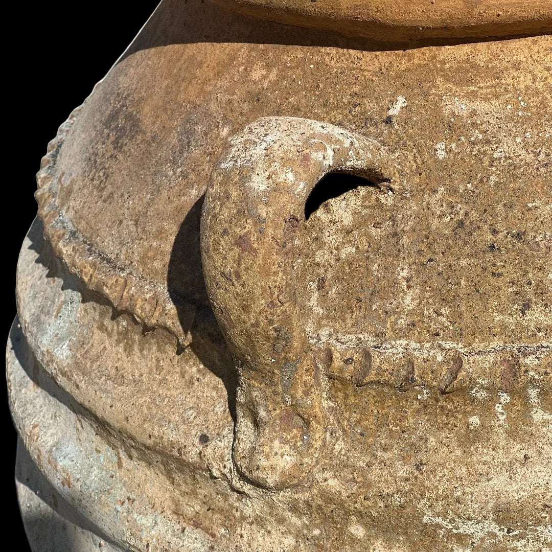 Ancient Ribbed Belly Urn with Handles and warn patina with a close up of the handles