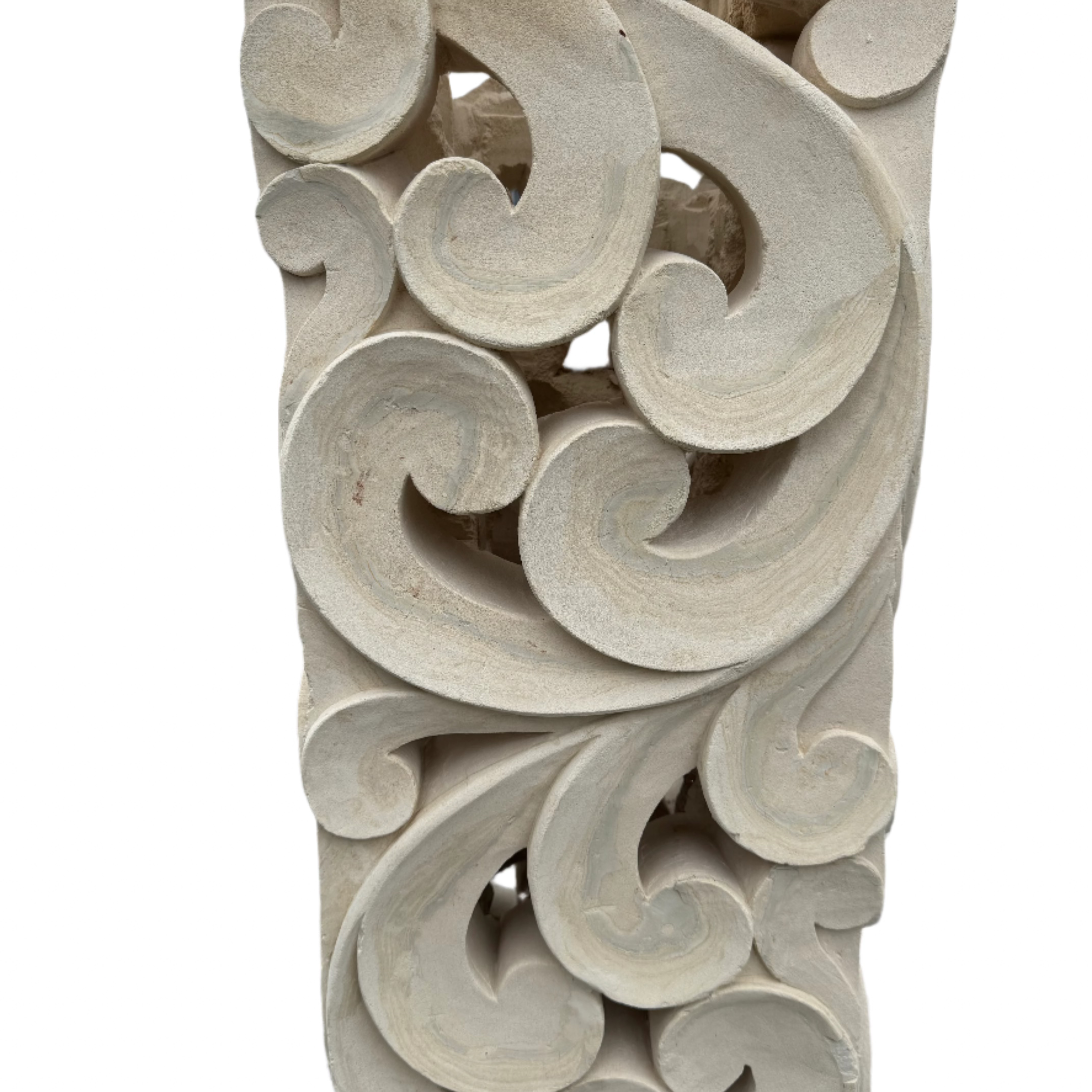 Natural organic limestone square plinth that features a hand carved ornate tribal sculpture close up