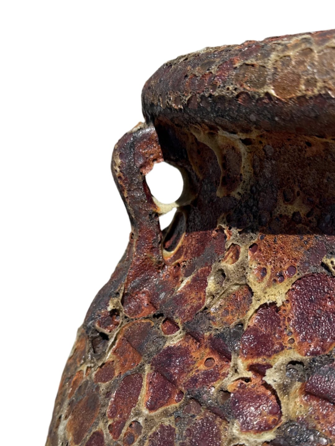 Rust lava rock Atlantis garden urn patina close up of handles