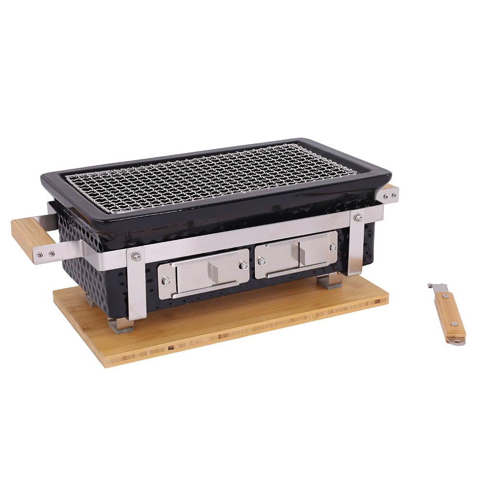 Portable grill with wooden base and wooden handle on a white background