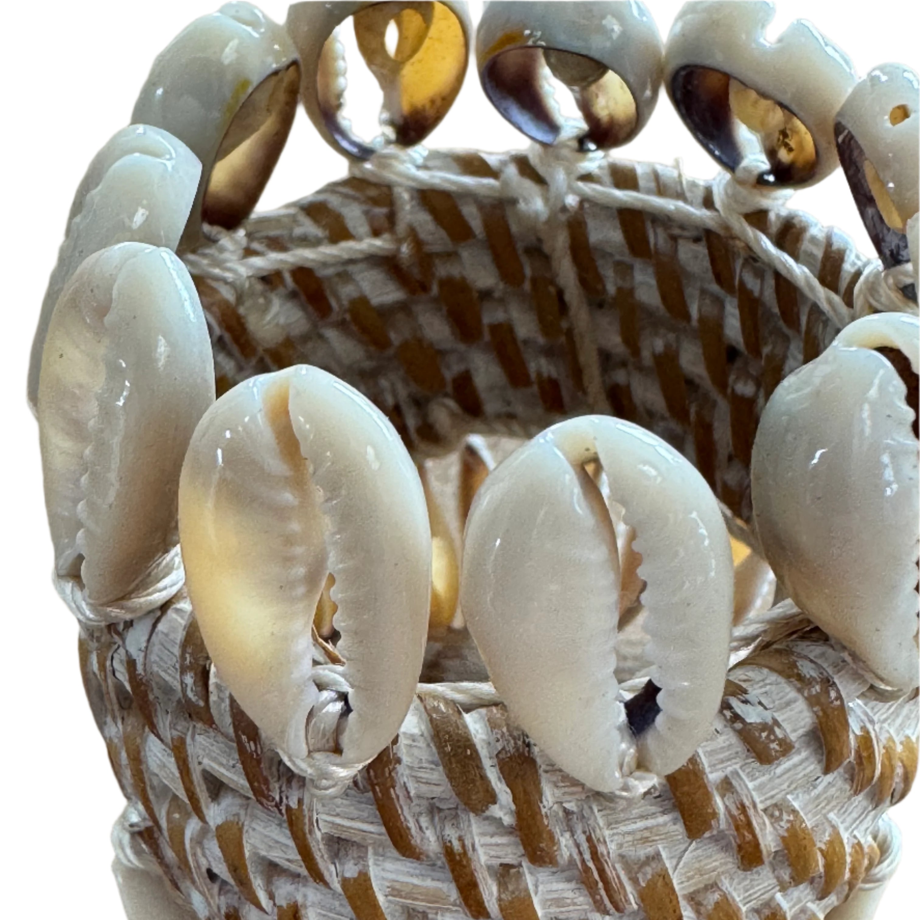 rattan and cowrie shell napkin holder close up