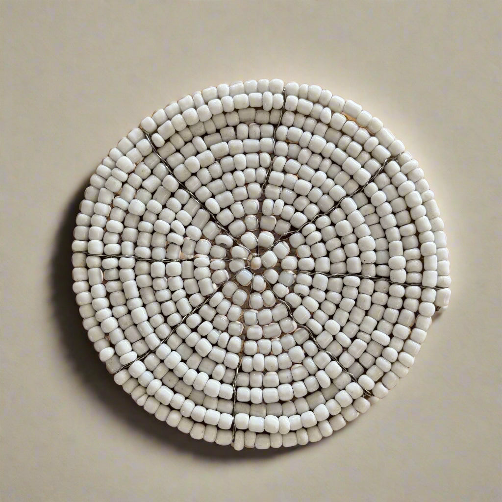 white beaded drink coaster