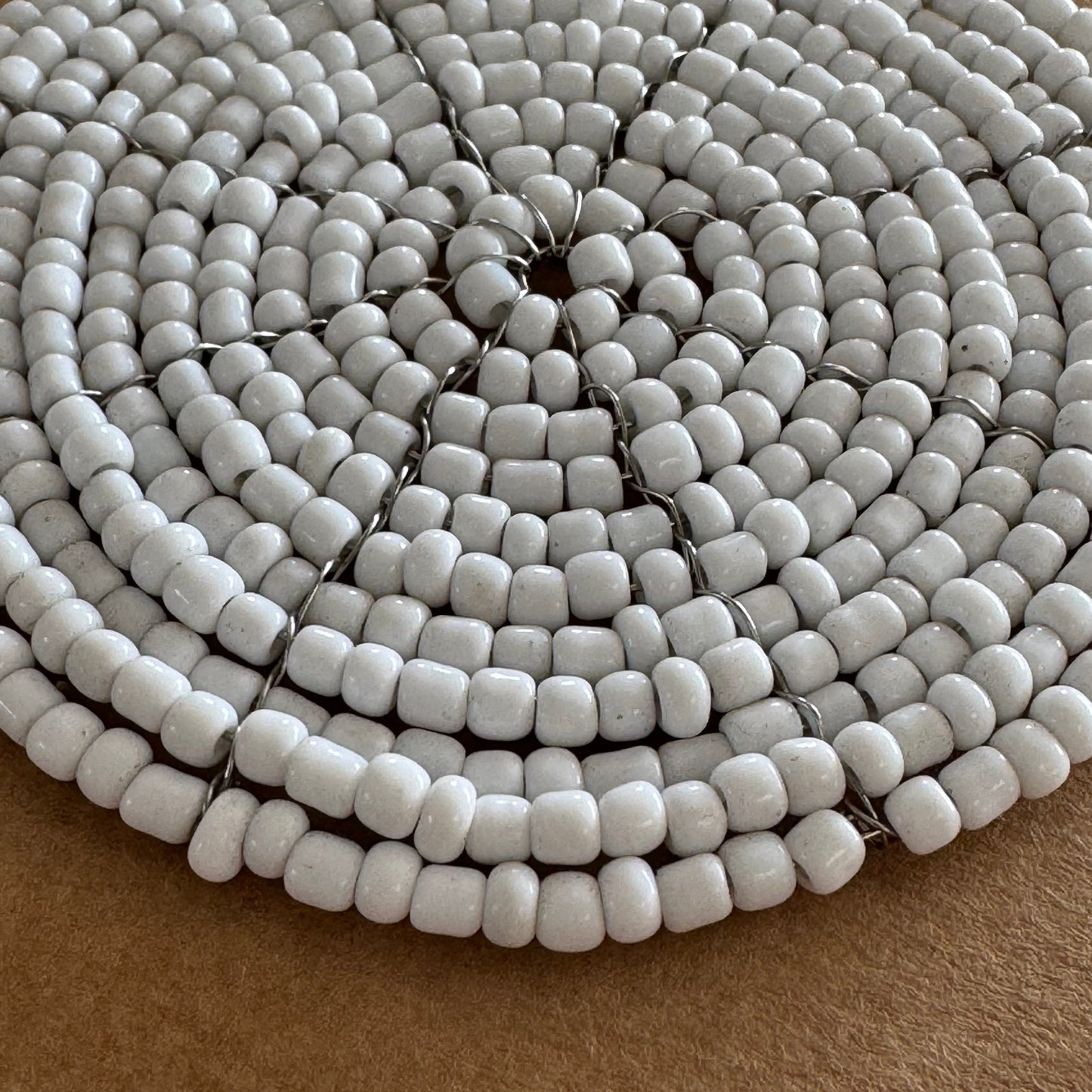 white beaded drink coaster close up