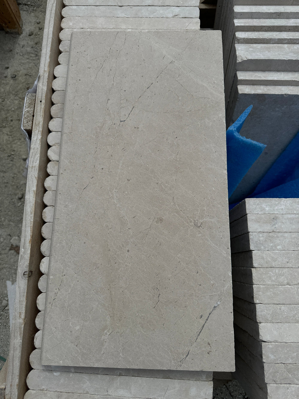 premium high quality Turkish Sahara Travertine Bullnose Pool Coping on top of crate of pool coping