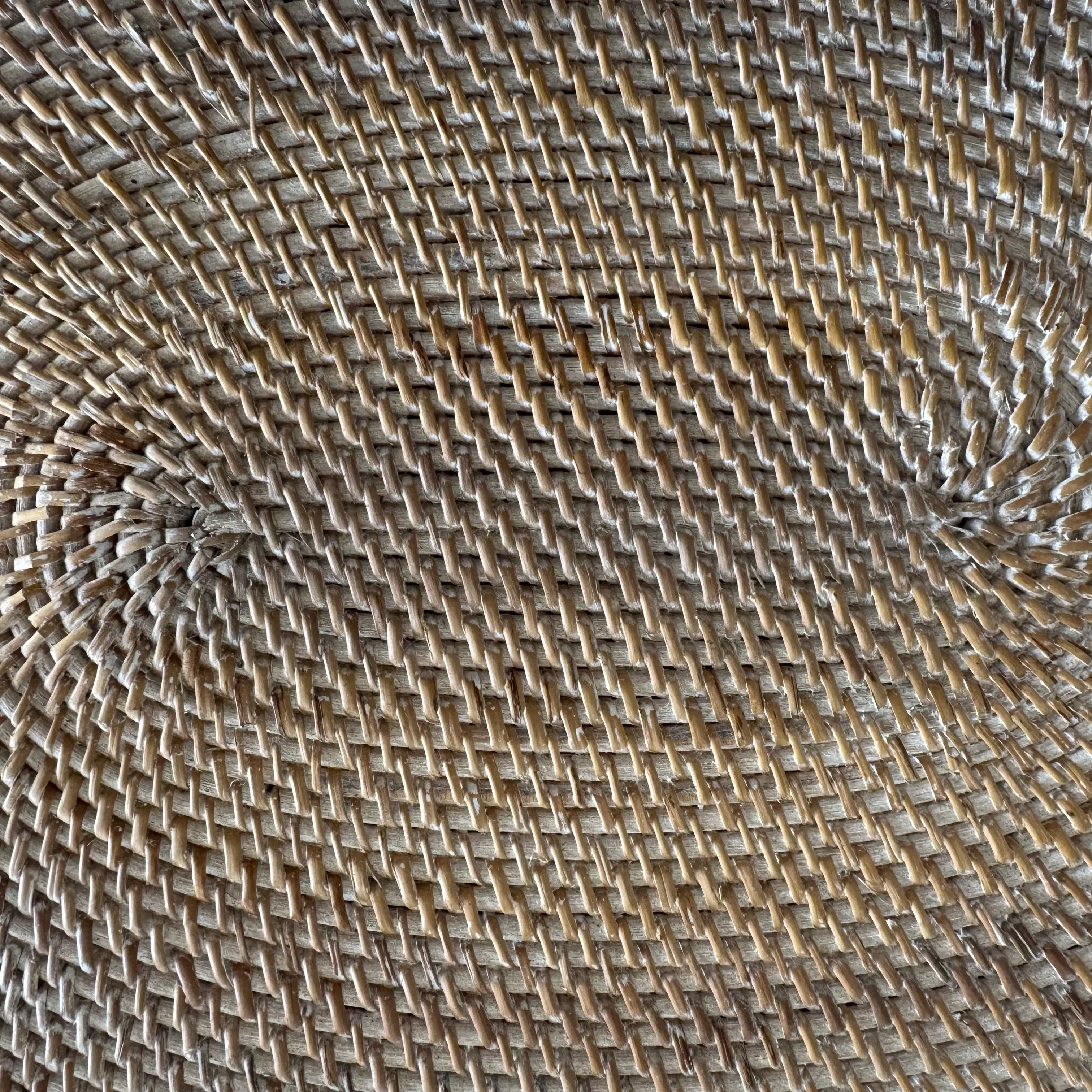 close up of the rattan weaving of the oval dining table placemat