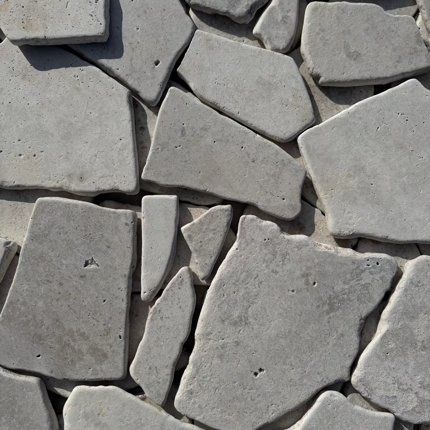 Close-up of silver travertine crazy paver stone honed tiles