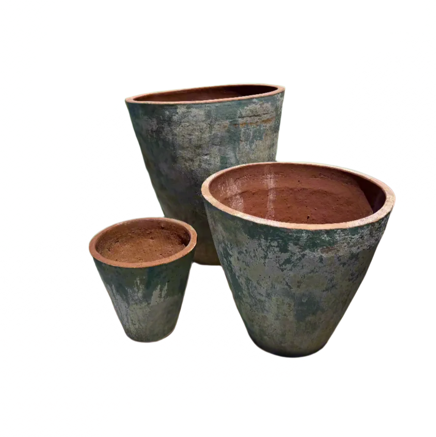 xl ancient tall cone garden pot tree planters in three different sizes with a faded blue patina outside in a green room